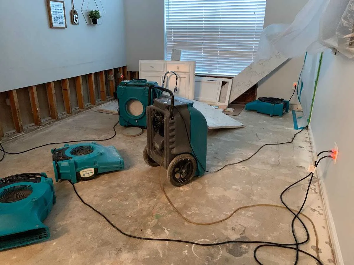 Dehumidifier in flood-cut room for Water Damage Restoration in Wells